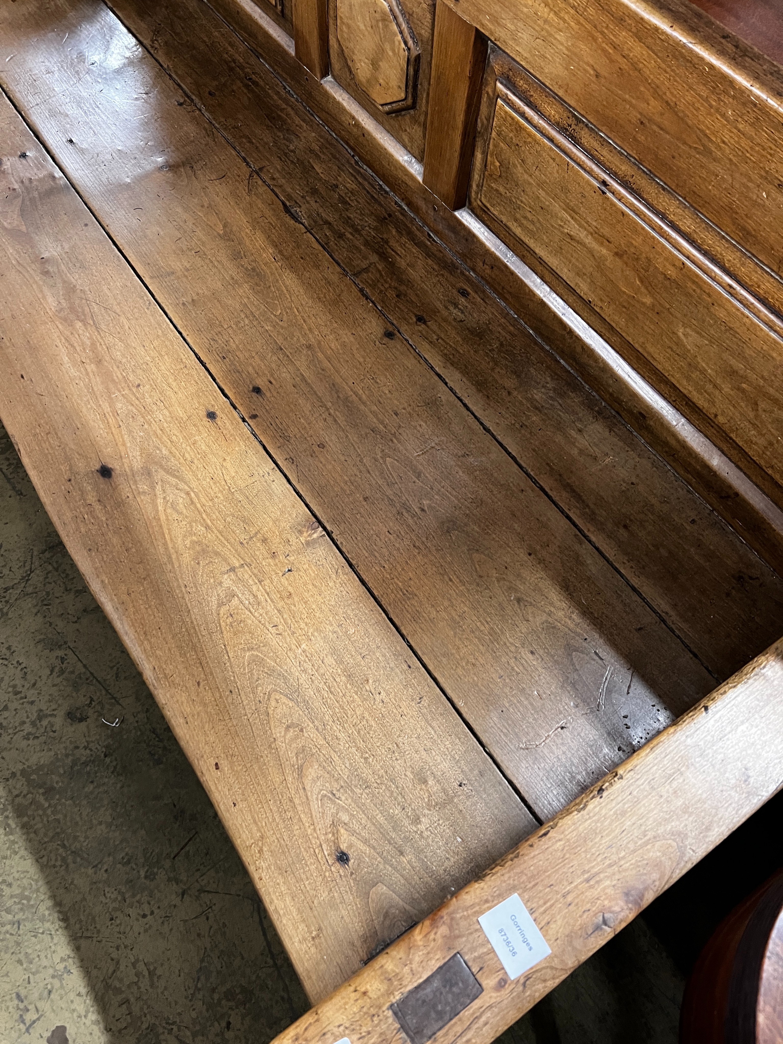 A 19th century Continental panelled settle, length 187cm, depth 70cm, height 92cm